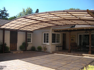 Custom-built iron arbor carport structure by Hines Custom Fence & Iron