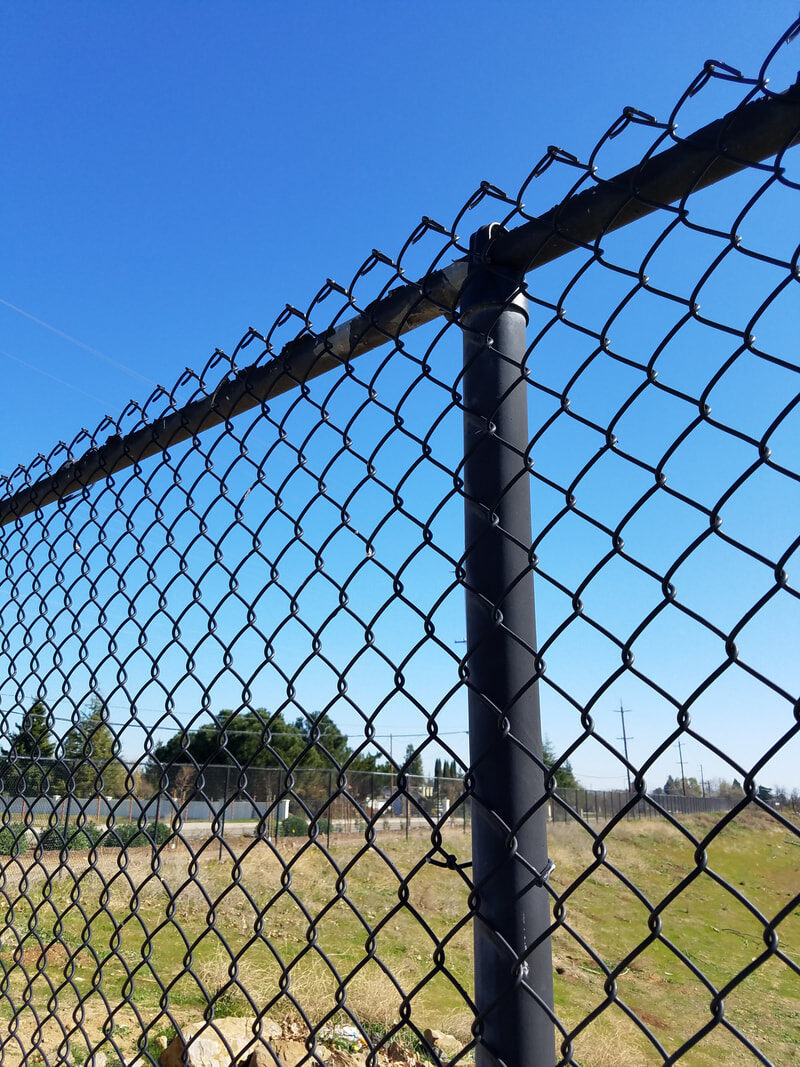 Chain link temporary fencing installed at a residential property