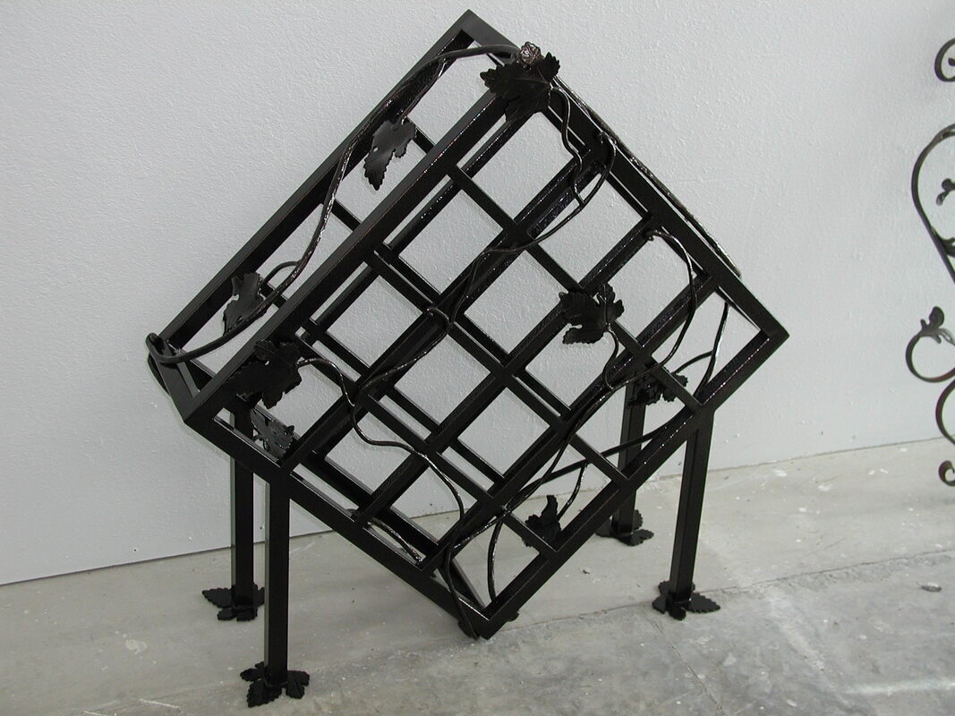 Custom fabricated iron wine rack showcasing in-house metalwork