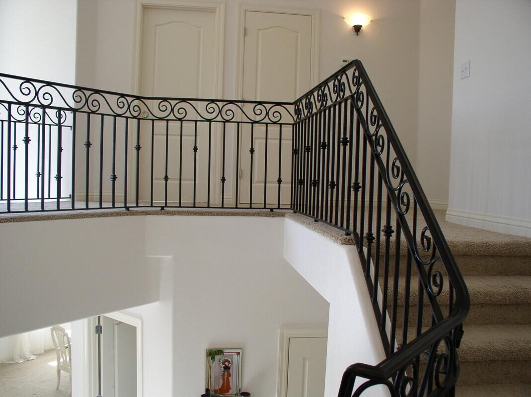 Custom hand-forged stairway and balcony railing