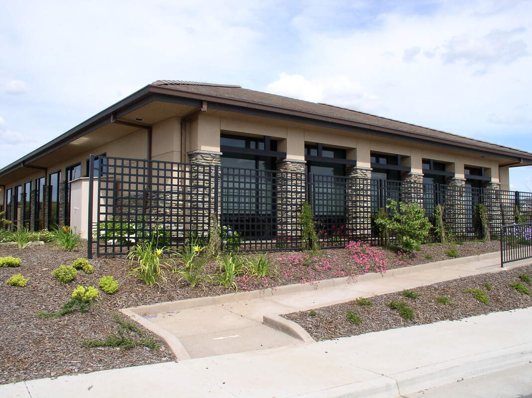 Custom woven iron garden trellis built by Hines Custom Fence & Iron