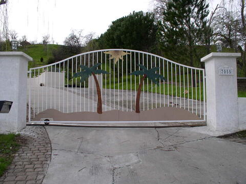 Custom beach-themed driveway gate