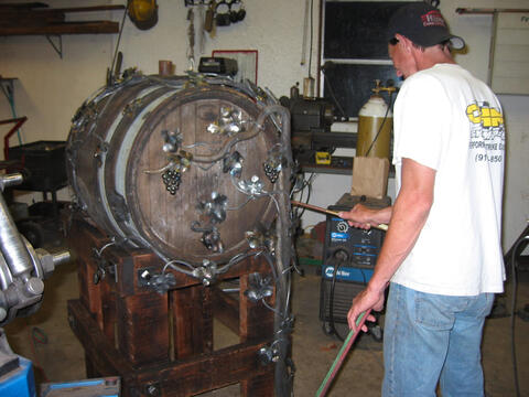 Custom fabricated iron wine barrel holder