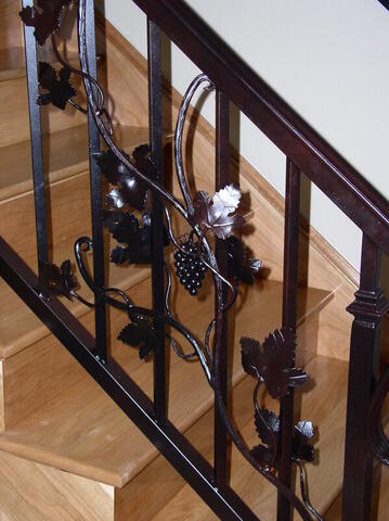 Stair railing with grape vine and leaf detail